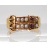 AN UNUSUAL DOUBLE BUCKLE RING set with rubies and pearls, with 15ct gold Birmingham 1890