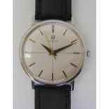 A VINTAGE OMEGA WRISTWATCH with a stainless steel case, brushed silvered cross hairs dial with