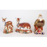 A LARGE ROYAL CROWN DERBY PAPERWEIGHT OF A DEER another smaller of a fawn and a Bald Eagle