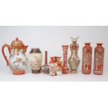 A COLLECTION OF KUTANI CERAMICS Comprising; Hot water jug,31cm high, a pair of vases, 25cm high,