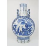 A CHINESE BLUE AND WHITE PILGRIM BOTTLE  painted with panels of figures in gardens within a