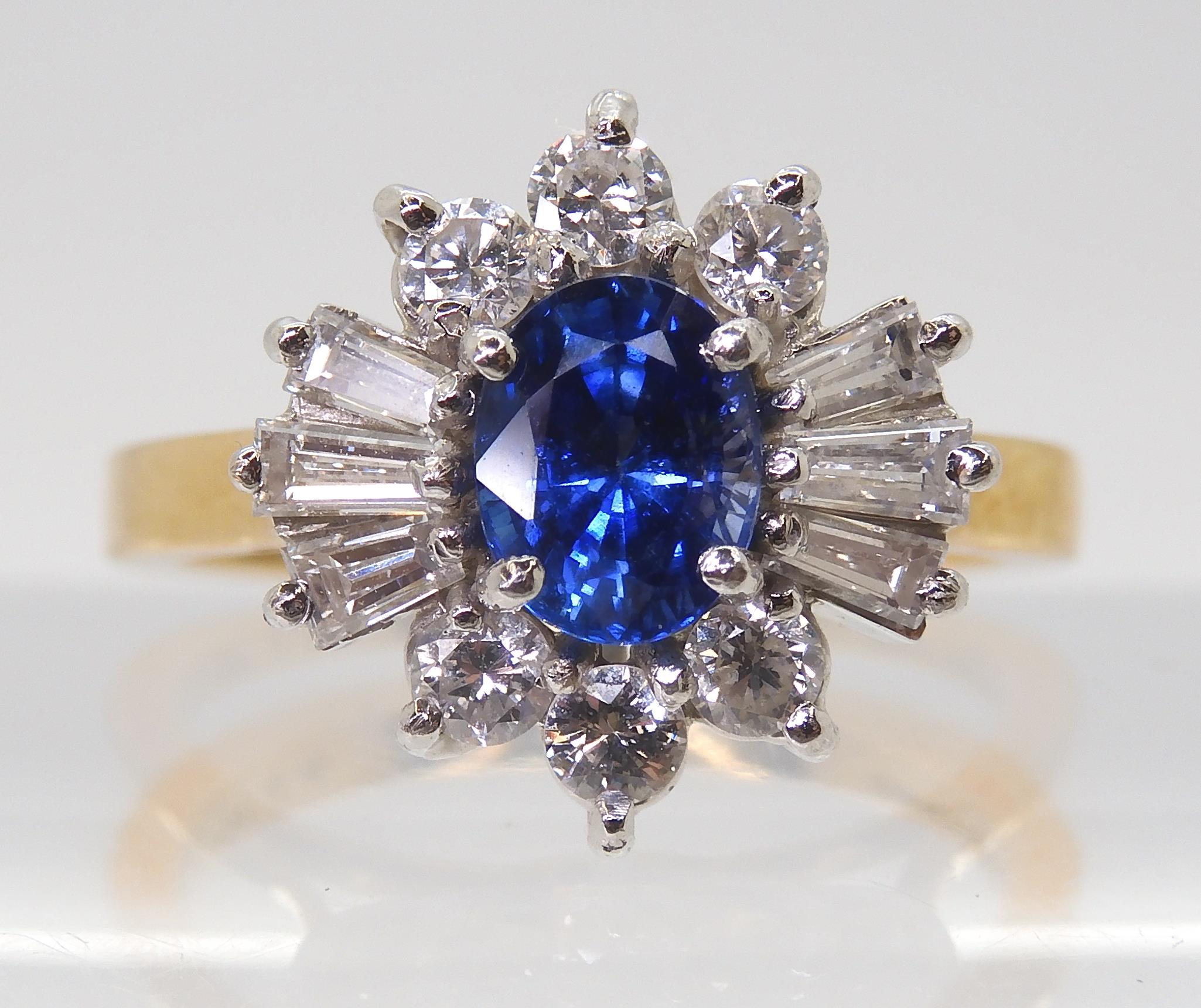 A SAPPHIRE & DIAMOND CLUSTER RING set in 18ct yellow and white gold, the starburst configuration