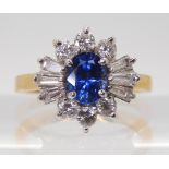 A SAPPHIRE & DIAMOND CLUSTER RING set in 18ct yellow and white gold, the starburst configuration