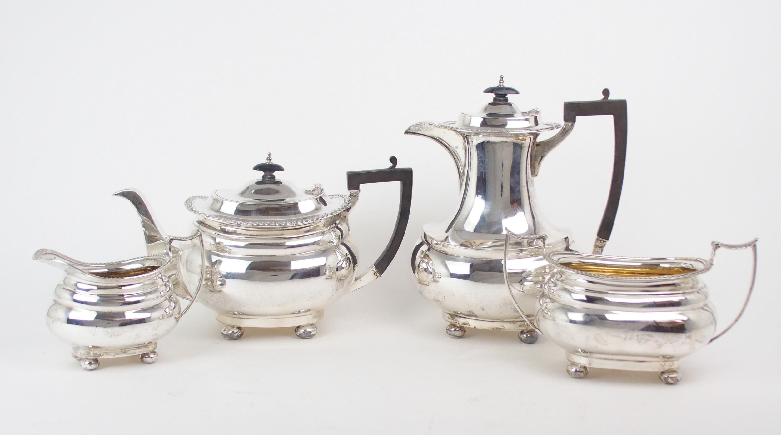 A GEORGE V FOUR PIECE SILVER TEA SERVICE by James Deakin & Sons, Sheffield 1918, of swollen baluster