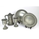 A VICTORIAN PEWTER COMMUNION SET Comprised of flagon (standing approx. 30.5cm in height), two