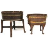 TWO OAK OVAL COOPERED WINE COOLERS ON STANDS  the first with ivorine label to interior "R,A, Lister
