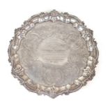 A GEORGE III SILVER SALVER by William Bennett, London 1807, of shaped circular form, with a cast