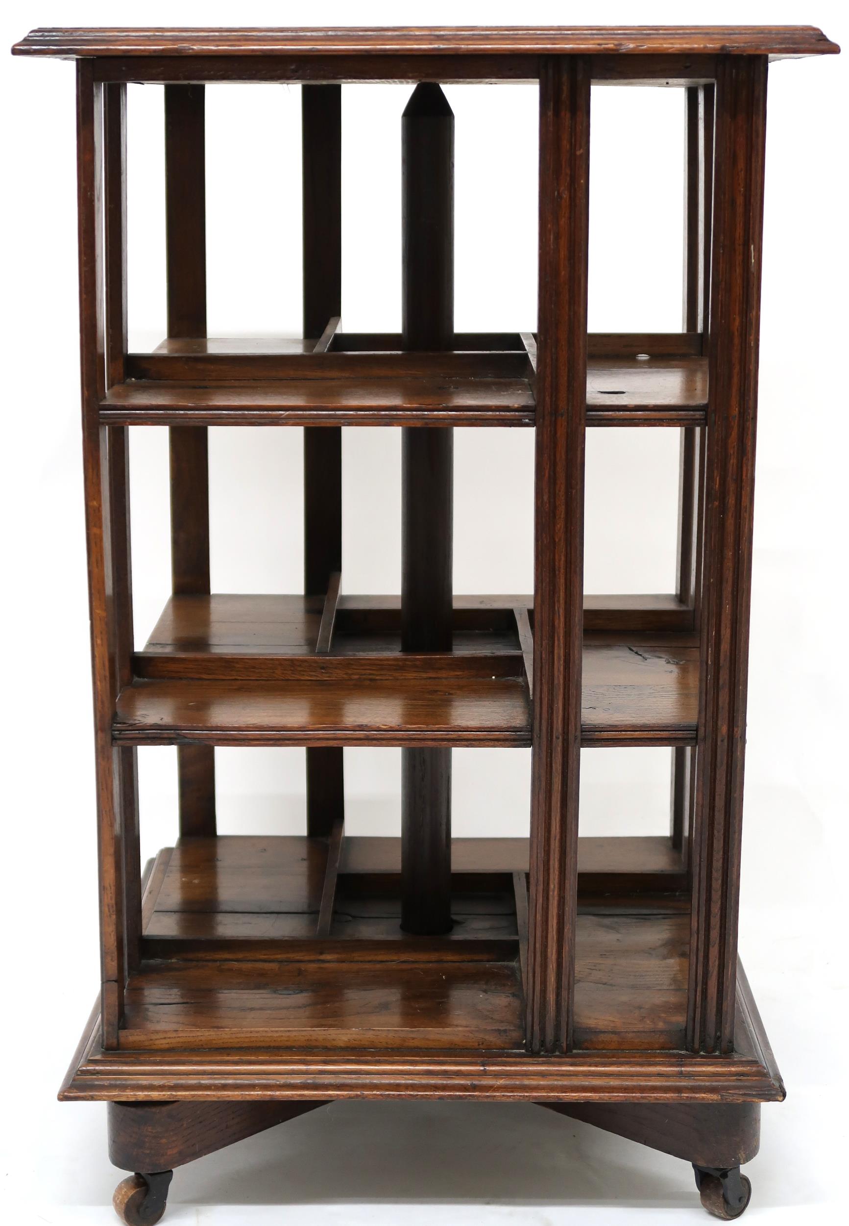 AN EARLY 20TH CENTURY OAK AND PINE GOODALL, LAMB & HEIGHWAY LTD MANCHESTER REVOLVING BOOKCASE