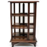 AN EARLY 20TH CENTURY OAK AND PINE GOODALL, LAMB & HEIGHWAY LTD MANCHESTER REVOLVING BOOKCASE
