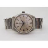 A ROLEX OYSTER PERPETUAL with stainless steel body and Oyster strap, silvered dial with chevron