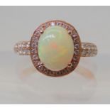 A LE VIAN OPAL & DIAMOND RING mounted in 14k rose gold, and set with estimated approx 0.50cts of