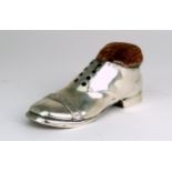 A GEORGE V NOVELTY SILVER PIN CUSHION by S. Blanckensee & Son Ltd, modelled in the form of a shoe,