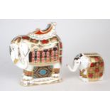 A LARGE ROYAL CROWN DERBY ELEPHANT PAPERWEIGHT modelled with a howdah on it's back, gold stopper,