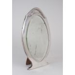 A GEORGE V SILVER DRESSING TABLE MIRROR by Mappin & Webb, Birmingham 1916, of shaped oval form,