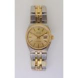 A TWO TONE ROLEX DATEJUST OYSTERQUARTZ the body in stainless steel and yellow gold with a two-tone