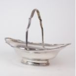 A LATE VICTORIAN SILVER SWING-HANDLED BREAD BASKET by Goldsmiths & Silversmiths Co Ltd, London 1900,