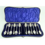 A CASED SET OF EDWARDIAN SILVER TEASPOONS AND SUGAR TONGS by John Round & Sons, Sheffield 1902, of