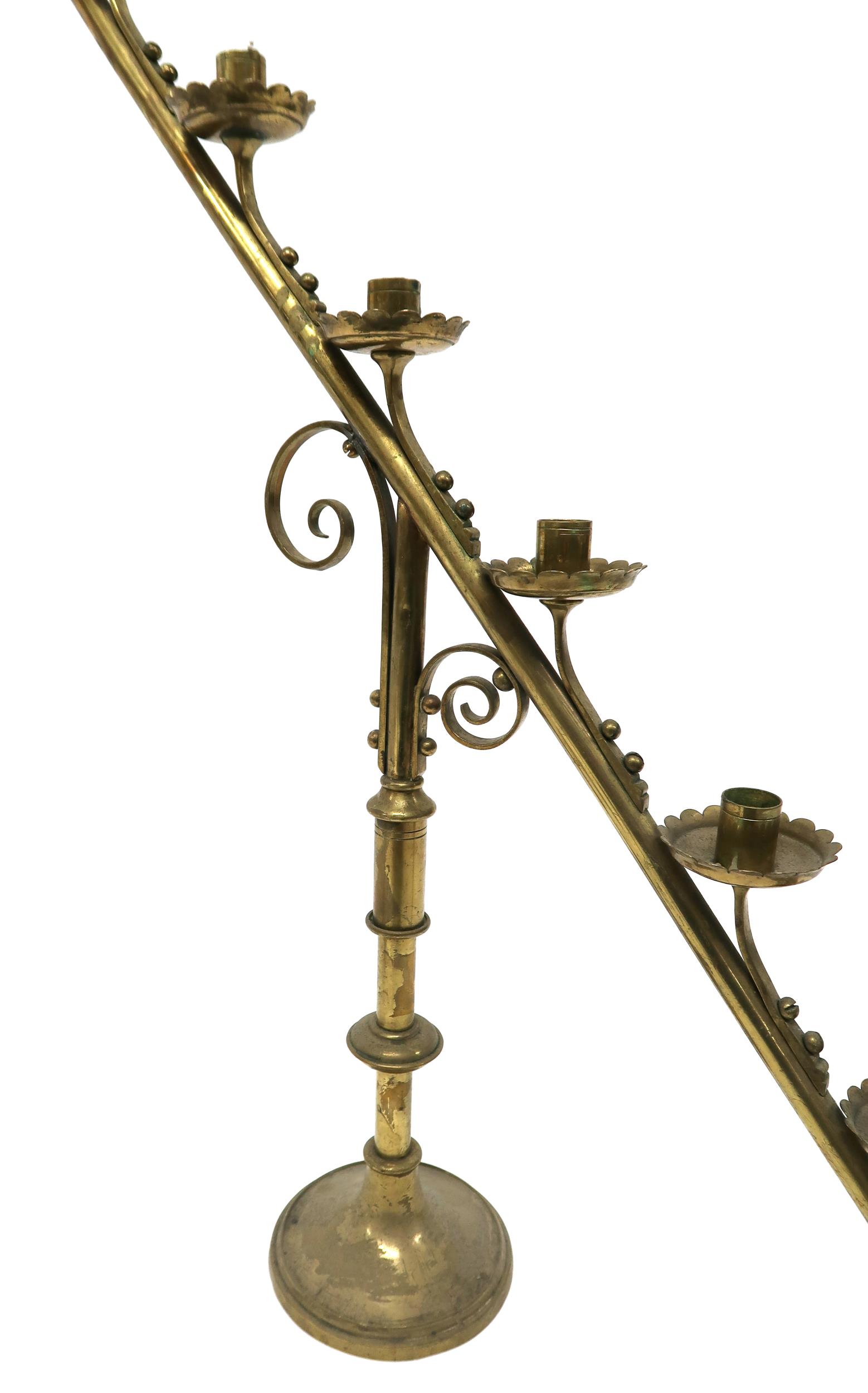 A PAIR OF 19TH CENTURY BRASS ECCLESIASTICAL SLOPED CANDELABRA each with seven candle holders with - Image 3 of 6