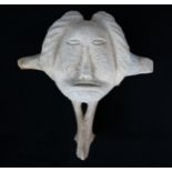 A 20TH CENTURY INUIT FIGURATIVE CARVING Bone, indistinctly inscribed on base, 33cm (13") high