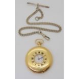 A SLIM HALF HUNTER POCKET WATCH the case in 18ct gold, the front with black enamelled chapter