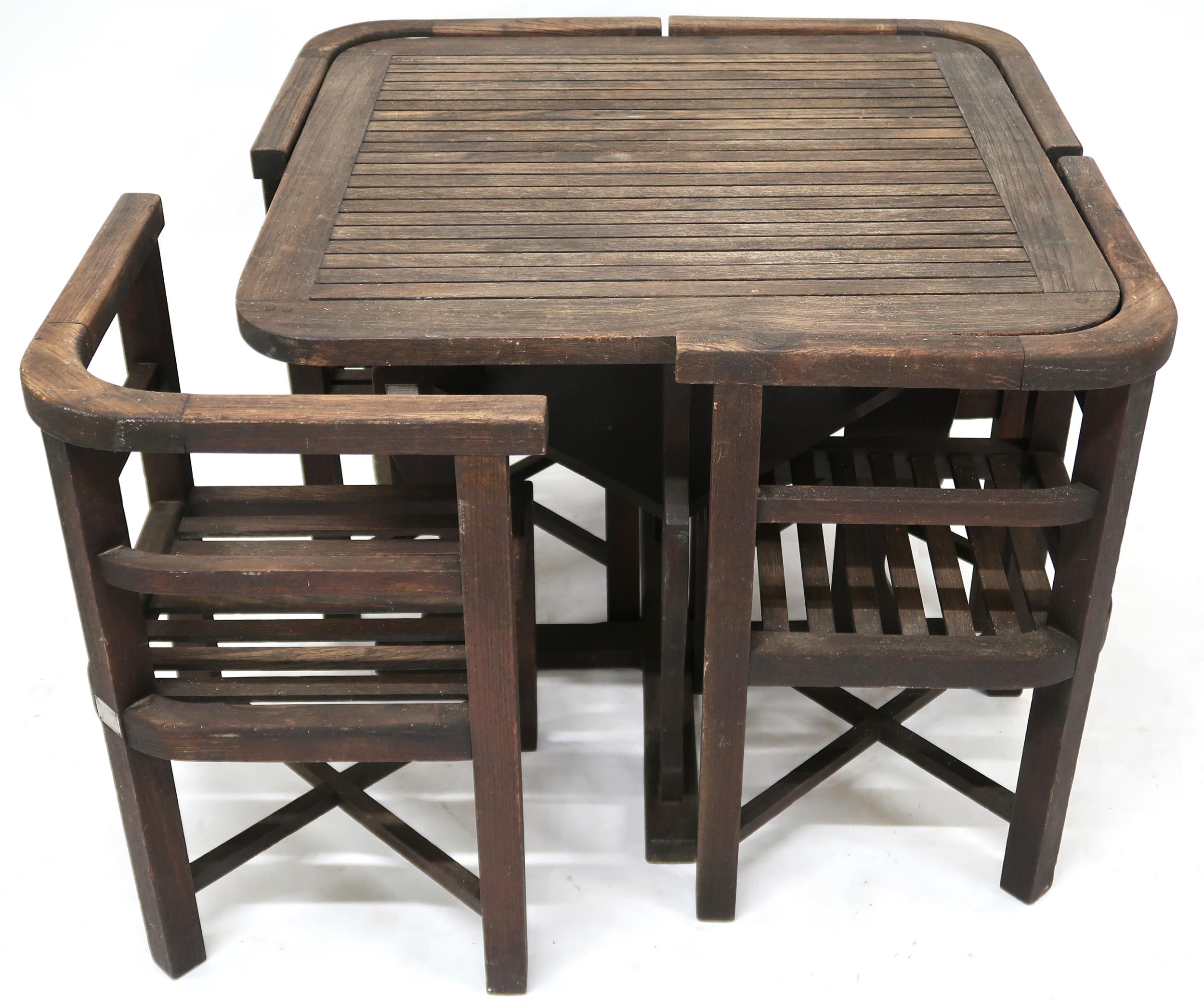 A CIRCA 1935 TEAK HEALS OF LONDON GARDEN TABLE AND CHAIRS  the teak for the suite having been - Image 2 of 13