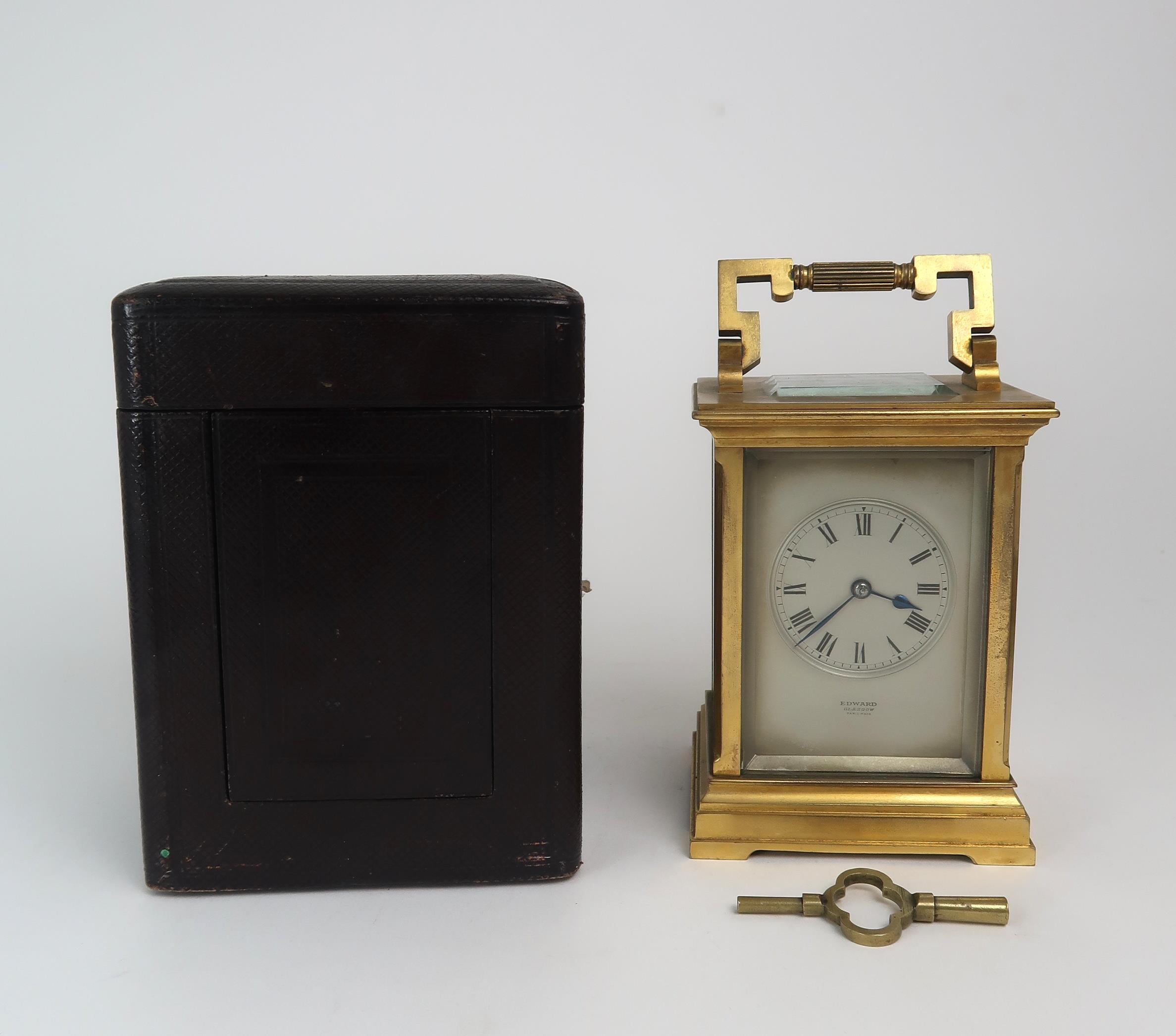 A 19TH CENTURY FRENCH BRASS AND GLASS CARRIAGE CLOCK with silvered dial, and roman numerals,