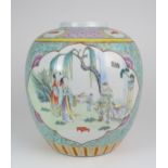 A CHINESE FAMILLE ROSE JAR  Painted with panels of figures before pavilions and reserved on a