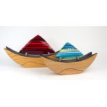 SCOTT IRVINE (SCOTTISH b. 1970) A fused glass and ash boat sculpture, 48cm diameter, numbered no