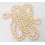 A CONTINUOUS ROPE LENGTH OF PEARLS each cream pearl is approx 6.7mm, and the total length is