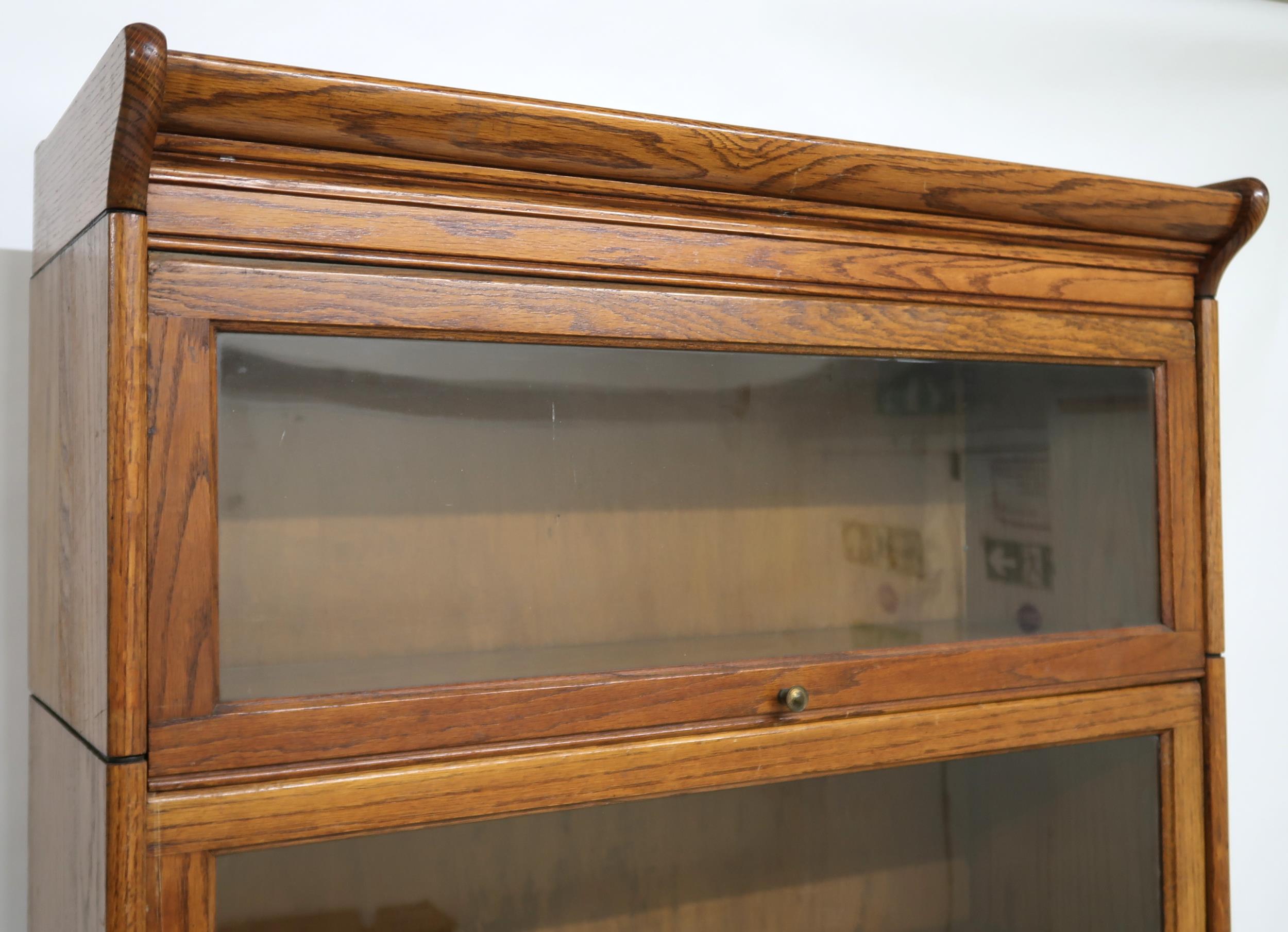 AN EARLY 20TH CENTURY OAK GLOBE-WERNICKE STYLE SIX TIER SECTIONAL BOOKCASE with six glazed doored - Image 3 of 13