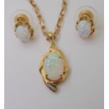 AN 18CT GOLD OPAL & DIAMOND PENDANT set with a 14mm x 9.8mm solid white opal, and diamond accents