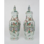A PAIR OF CANTON HEXAGONAL VASES AND COVERS  painted with horse riders before dignitaries on