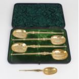 A CASED SET OF VICTORIAN SILVER GILT ANNOINTING SPOONS by Francis Higgins III, London 1892, modelled