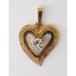 A 9CT GOLD HEART PENDANT  set with an estimated approx 0.30cts brilliant cut diamond, with Edinburgh