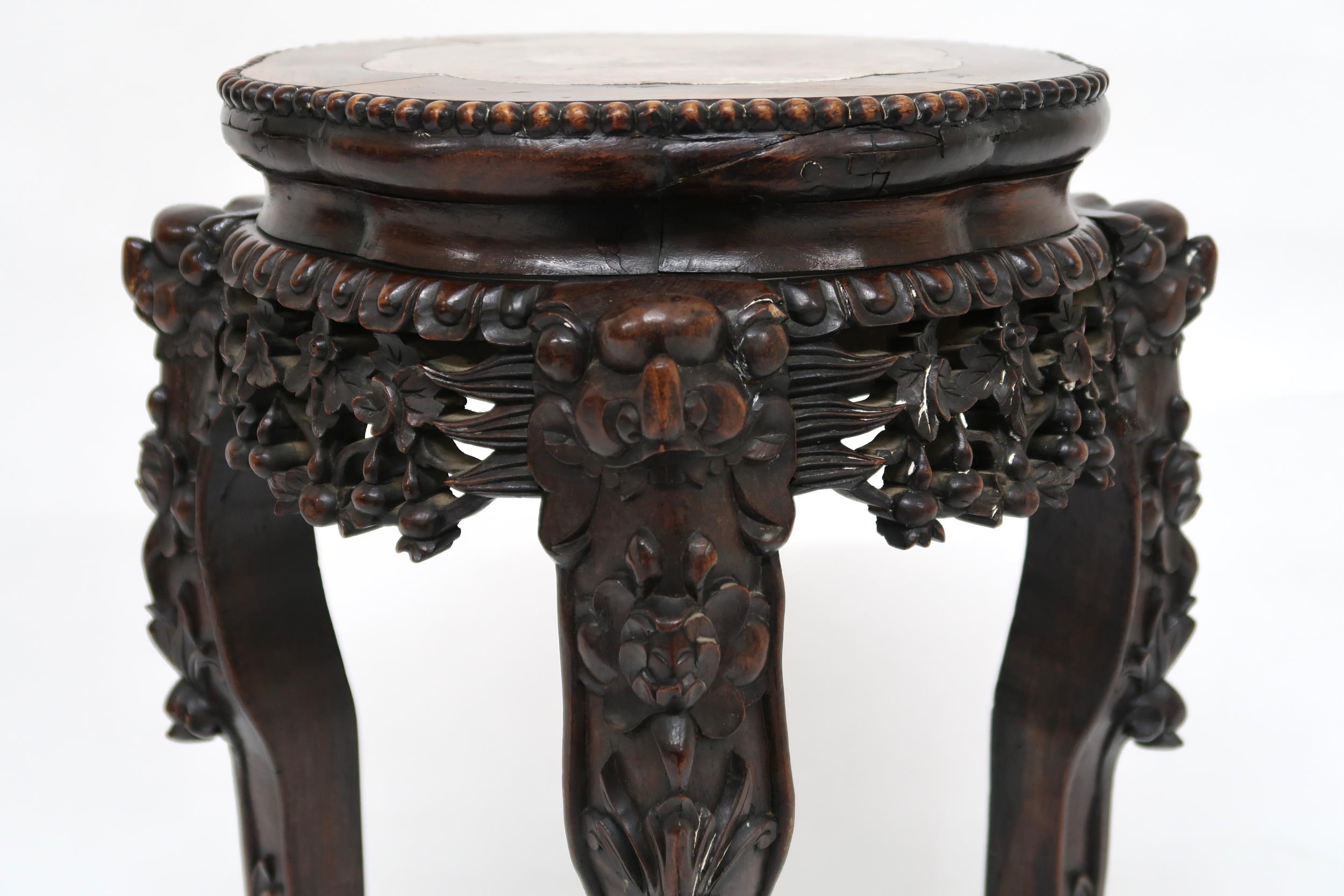 A CHINESE HARDWOOD JARDINERE STAND  with shaped top inset with pink marble over floral carved - Image 7 of 9