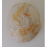 A LARGE UNMOUNTED CLASSICAL CAMEO finely carved in two-tone shell, depicting Hebe feeding her father