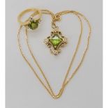 A BESPOKE PERIDOT & DIAMOND SUITE mounted throughout in 18ct gold, the pendant was designed by