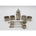 A silver caster, by Edward Barnard & Sons, London, of baluster form, a set of four silver napkin