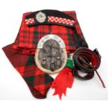 Highland wear, comprising a sealskin sporran, kilt with coordinating woollen hose, an Argyll &