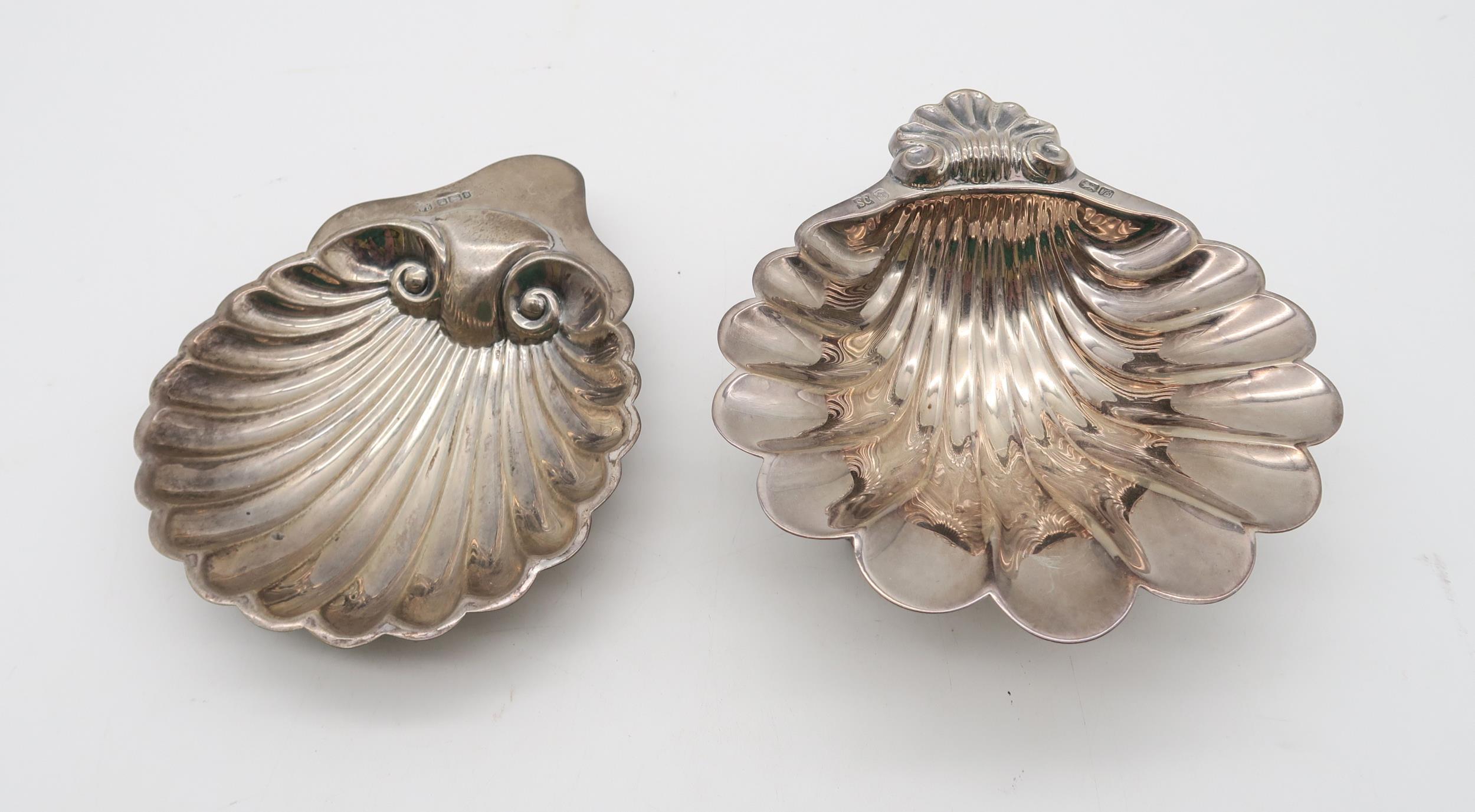 A silver scallop butter dish, by Deakin & Francis, Sheffield, and another example by SC, Sheffield