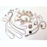 A silver charm bracelet with twelve large charms, and a collection of silver charms Condition