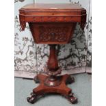 A Victorian rosewood sewing table with hinged top concealing fitted interior with carved aprons on