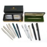 A collection of propelling pencils, ballpoint and fountain pens, with examples by Cross, Parker,