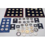 A lot of commemorative coins including 50p pieces and gold plated examples together with two