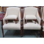A lot comprising a pair of 20th century cream upholstered armchairs with reeded frames on turned