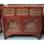 An early 20th century Chinese side cabinet with three short drawers carved with birds and floral