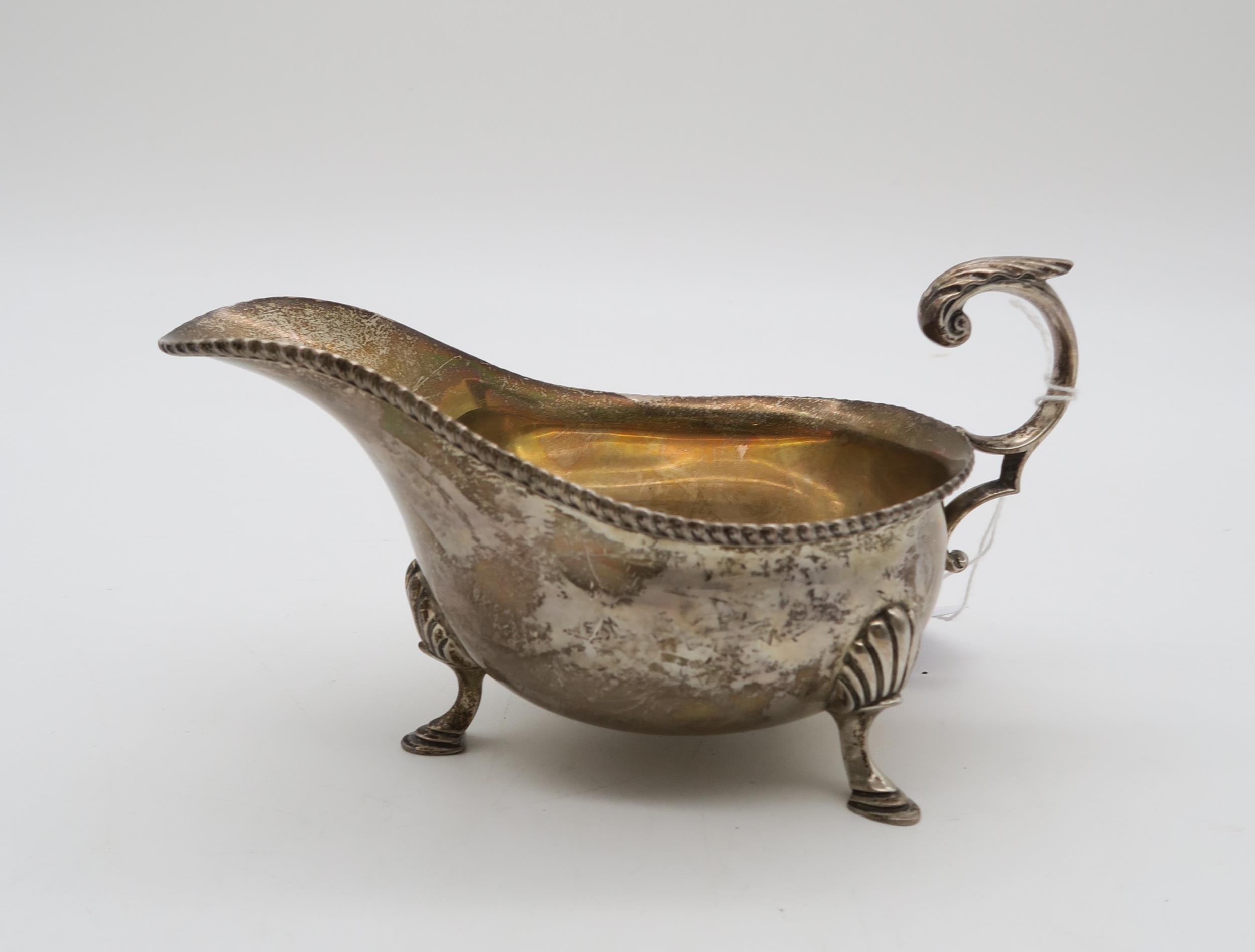 A silver sauce boat, by Harrison Brothers & Howson, London 1931, in the George III style, with a