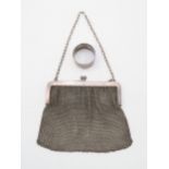 A silver chain mesh purse, with import marks for Paul Ettinger, London, and an EPNS napkin ring (