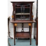 A late Victorian mahogany Arts & Crafts cabinet with single floral stained glass door concealing two