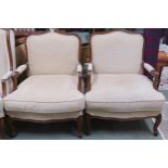 A pair of 20th century reproduction cream upholstered open armchairs on cabriole supports, 97cm high
